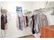 Spacious walk-in closet with clothes hanging and wire shelving for storage at 709 Blackstone St, Minneola, FL 34715