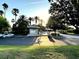 Beautiful community entrance surrounded by palm trees and lush landscaping, creating a welcoming atmosphere at 7240 Westpointe Blvd # 1122, Orlando, FL 32835