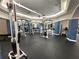 Bright gym featuring weight machines, mirrored walls, and well lit open space at 7240 Westpointe Blvd # 1122, Orlando, FL 32835