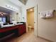 Bright bathroom featuring a double sink vanity, tile flooring, and a separate toilet room for added privacy at 8125 Resort Village Dr # 5310, Orlando, FL 32821