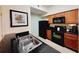 Modern kitchen with black appliances, granite countertops and tile backsplash at 8125 Resort Village Dr # 5310, Orlando, FL 32821