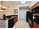 Well-equipped kitchen with dark appliances, countertops, and ample cabinet space at 8125 Resort Village Dr # 5310, Orlando, FL 32821