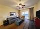 Comfortable living room with couch, chair, and balcony access showcasing ocean view at 8125 Resort Village Dr # 5310, Orlando, FL 32821