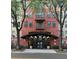 Attractive building entrance with covered entrance and 'Uptown Place' sign at 911 N Orange Ave # 142, Orlando, FL 32801