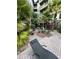 Serene courtyard with lounge chairs and tropical landscaping at 911 N Orange Ave # 142, Orlando, FL 32801