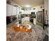 Well-lit kitchen boasts granite countertops, stainless steel appliances, and bright white cabinetry at 911 N Orange Ave # 142, Orlando, FL 32801