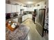 Well-equipped kitchen featuring stainless steel appliances, ample counter space and white cabinetry at 911 N Orange Ave # 142, Orlando, FL 32801