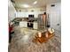 Well-lit kitchen boasts granite countertops, stainless steel appliances, and bright white cabinetry at 911 N Orange Ave # 142, Orlando, FL 32801