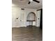 Comfortable living room featuring wood-look floors, a built-in desk area, and a storage closet at 911 N Orange Ave # 142, Orlando, FL 32801
