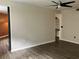 Spacious living room featuring wood-look floors and easy access to other rooms at 911 N Orange Ave # 142, Orlando, FL 32801