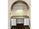 A small built-in office nook features storage cabinets, a desk, and a light at 911 N Orange Ave # 142, Orlando, FL 32801