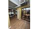 A versatile office space featuring sleek wood floors, modern ductwork, and ample natural light at 911 N Orange Ave # 142, Orlando, FL 32801
