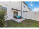 A fenced backyard with a patio and outdoor seating is perfect for relaxing outdoors at 916 Grandin St, Davenport, FL 33837
