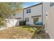 A fenced backyard with a sliding glass door and a small patio, perfect for relaxing outdoors at 916 Grandin St, Davenport, FL 33837