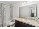 This bathroom features a combined shower and bath as well as a large vanity at 916 Grandin St, Davenport, FL 33837