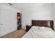 This bedroom shows a bedroom with carpet and a dark wooden headboard and side table at 916 Grandin St, Davenport, FL 33837