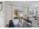 A dining room with a glass table, dark chairs and view of the backyard at 916 Grandin St, Davenport, FL 33837