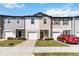 Charming townhomes with individual garages and a manicured lawn at 916 Grandin St, Davenport, FL 33837