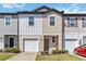 Charming townhomes with individual garages and manicured lawns at 916 Grandin St, Davenport, FL 33837