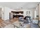 Open-concept living room flows into a modern kitchen with stainless appliances at 916 Grandin St, Davenport, FL 33837