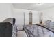 A view of the bedroom looking at the doorways to the Primary bath and closet at 916 Grandin St, Davenport, FL 33837