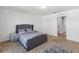 Relaxing bedroom with a plush bed, carpet flooring, and neutral décor at 916 Grandin St, Davenport, FL 33837