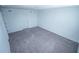 Bedroom with neutral carpeting and a door on the left at 947 Conch Rd, Davenport, FL 33896