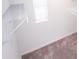 A bright closet featuring neutral carpeting and installed shelving at 947 Conch Rd, Davenport, FL 33896