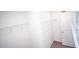 Closet featuring neutral carpeting and installed shelving at 947 Conch Rd, Davenport, FL 33896