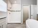 Elegant bathroom with a modern shower featuring white tile and decorative accents at 152 Big Black Dr, Kissimmee, FL 34759