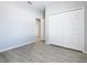 Spacious bedroom with a closet, gray walls and light wood look floors at 152 Big Black Dr, Kissimmee, FL 34759
