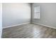 Well-lit bedroom with wood-look floors and a window that allows natural light at 152 Big Black Dr, Kissimmee, FL 34759