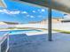 Backyard oasis featuring a private pool and outdoor kitchen area at 152 Big Black Dr, Kissimmee, FL 34759