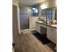 Bathroom featuring a double vanity, a large mirror, and a glass-enclosed shower at 11115 Sw 54Th Cir, Ocala, FL 34476