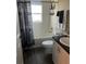 Full bathroom featuring a shower-tub combo and white vanity at 11115 Sw 54Th Cir, Ocala, FL 34476