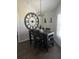Stylish dining area with a dark wood table, elegant light fixture, and unique wall decorations at 11115 Sw 54Th Cir, Ocala, FL 34476