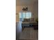 Bright living room with comfortable seating, a patterned rug, and access to an outdoor patio at 11115 Sw 54Th Cir, Ocala, FL 34476