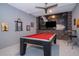 Entertainment room featuring a striking Star Wars mural, red billiard table and bar seating at 1137 Drop Ln # 1137, Davenport, FL 33896