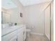 Modern bathroom featuring a sleek vanity with a quartz countertop and walk-in shower at 1137 Drop Ln # 1137, Davenport, FL 33896