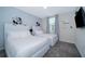 The bedroom features two twin beds, Mickey Mouse wall decor, and a flat-screen TV for entertainment at 1137 Drop Ln # 1137, Davenport, FL 33896