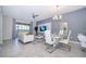 The dining room flows from the living room with a dining table and lots of seating at 1137 Drop Ln # 1137, Davenport, FL 33896