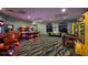 Community game room with multiple arcade games and two windows at 1137 Drop Ln # 1137, Davenport, FL 33896