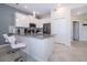 Modern kitchen with gray countertops, white cabinetry, stainless steel appliances, and bar seating at 1137 Drop Ln # 1137, Davenport, FL 33896