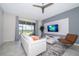 Comfortable living room with stylish white sofa, modern decor, and sliding glass doors to the outdoor area at 1137 Drop Ln # 1137, Davenport, FL 33896