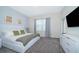 Cozy bedroom featuring a comfortable bed, stylish curtains, and a modern dresser with a mounted television at 1137 Drop Ln # 1137, Davenport, FL 33896