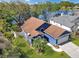 Attractive home with a two-car garage, a well-kept lawn, and scenic lake views at 13223 Meadowlark Ln, Orlando, FL 32828
