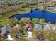 Overhead shot of a lakeside community showcasing lush greenery, serene water features, and lovely homes at 13223 Meadowlark Ln, Orlando, FL 32828