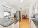 Bright kitchen with stainless steel appliances, granite countertops and white cabinetry at 13223 Meadowlark Ln, Orlando, FL 32828