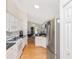 Galley style kitchen with stainless steel appliances and direct access to the water view at 13223 Meadowlark Ln, Orlando, FL 32828