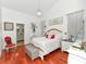 Bright main bedroom with wood floors, chandelier, and ensuite bathroom at 13223 Meadowlark Ln, Orlando, FL 32828